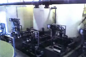 Industrial machinery with pipes and control panels.