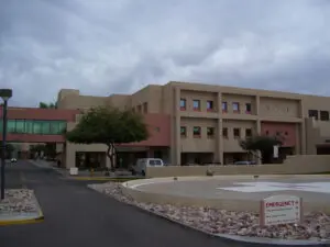 Hospital building with emergency entrance signage.