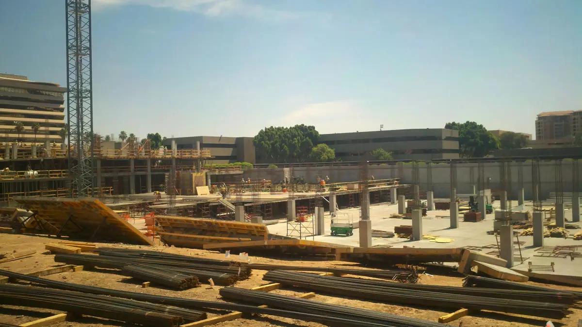 Construction site with cranes and building materials.
