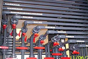 Pipes and valves in industrial setting.