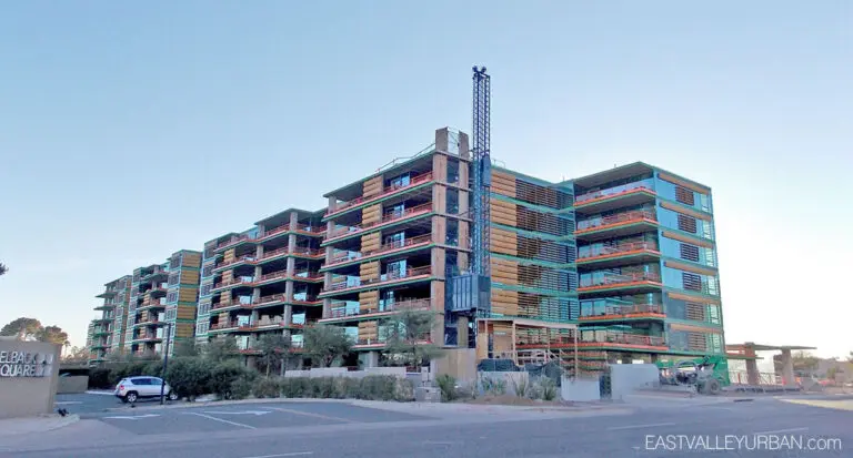 Modern multi-story building under construction.