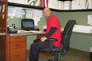 Man working at desk in an office.