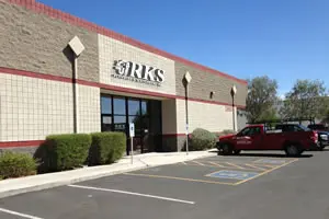 Exterior of a commercial building with truck.
